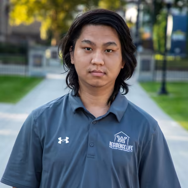 Birun Rana wearing a Wilkes University Residence Life polo